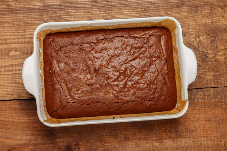A chocolate sheet cake in a rectangular pan.