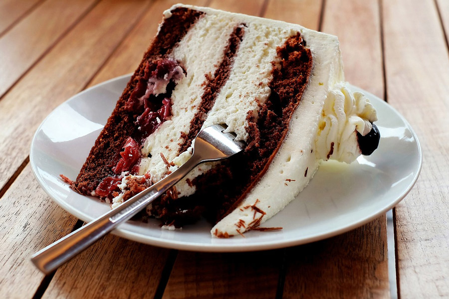 A piece of black forest cake on a plate.