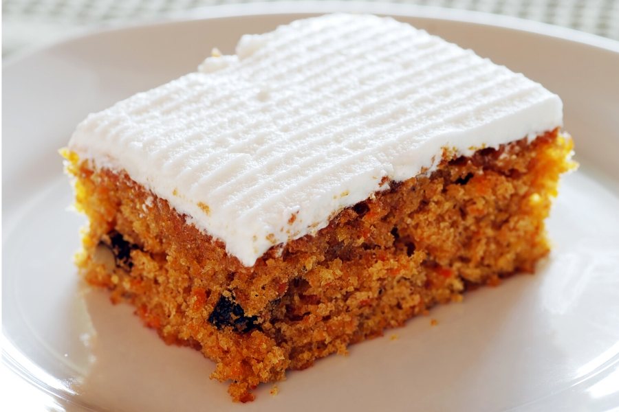 A piece of glazed banana and carrot cake.
