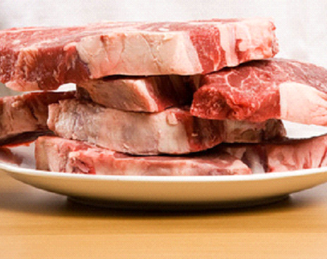 Raw beef steaks.