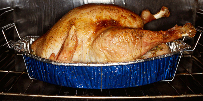 Turkey roasting in a tin.