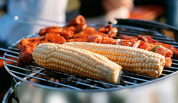 Grilling corn and kebabs.