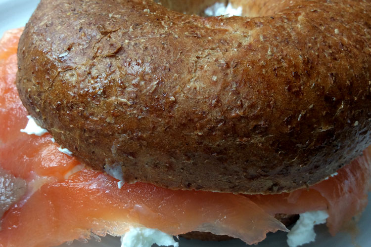 Smoked salmon and cream cheese in wholegrain bagel.