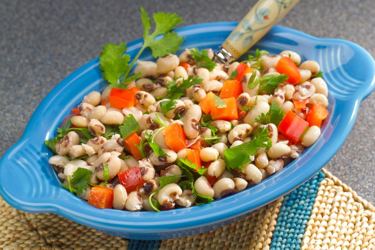 Black eyed pea salad in a blue container.