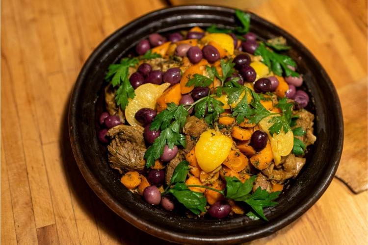 Detail of a lamb tagine with lemons and olives.