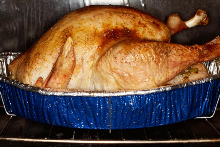 Turkey roasting in a tin.