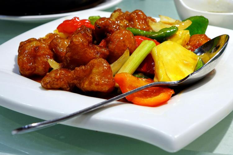 Sweet and sour pork in a serving plate.