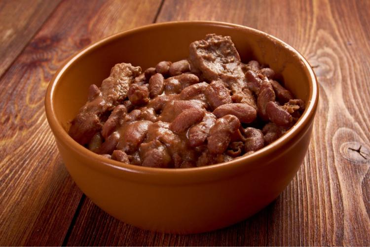 A bowl with Boston baked beans.