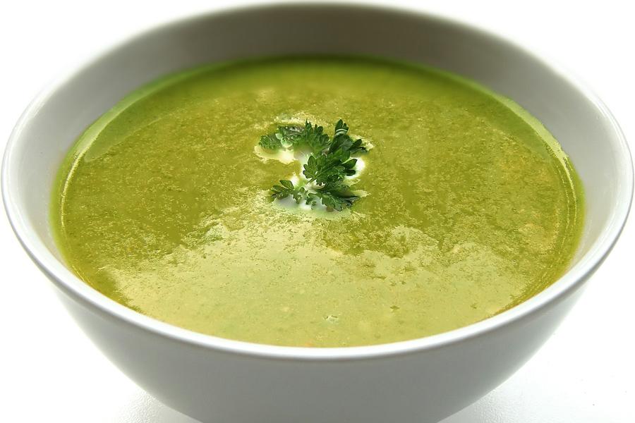 Lettuce soup in a white ceramic bowl.