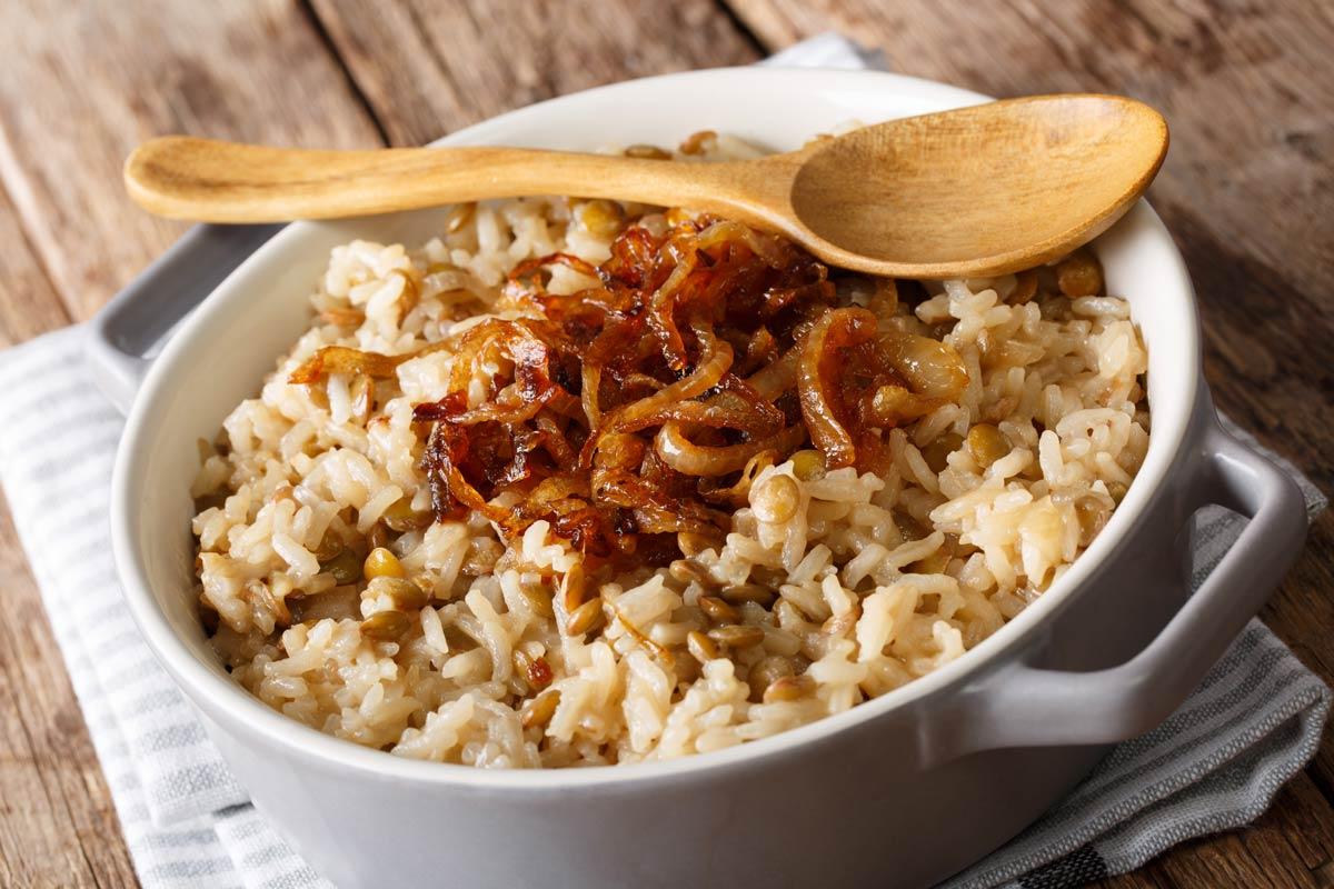 Mujaddara with caramelised onions in a bowl.