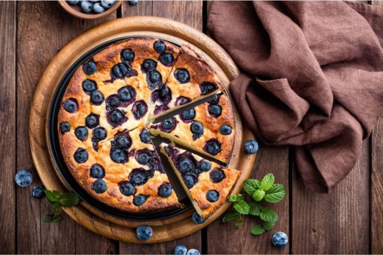 Blueberry cake on a serving plate.