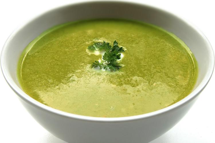 Lettuce soup in a white ceramic bowl.