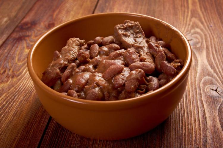 A bowl with Boston baked beans.
