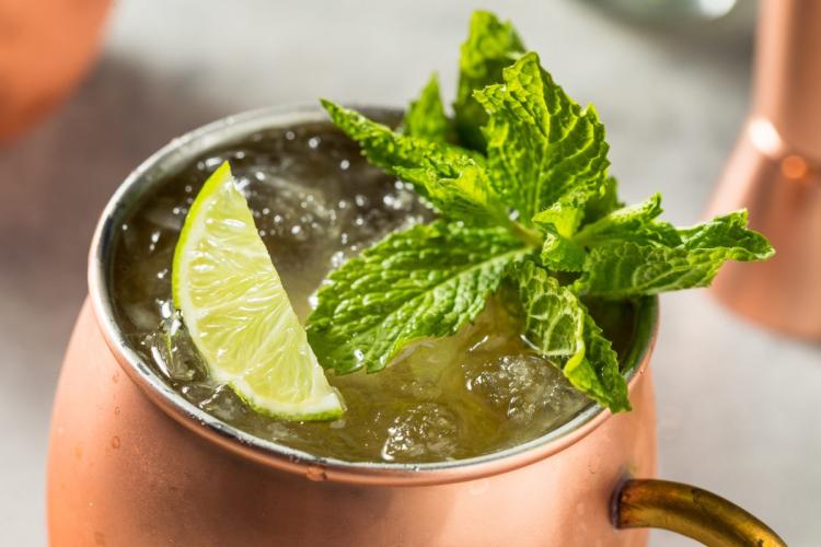 Irish Mule cocktail in a copper mug with crushed ice, garnished with fresh mint and a lime wedge.