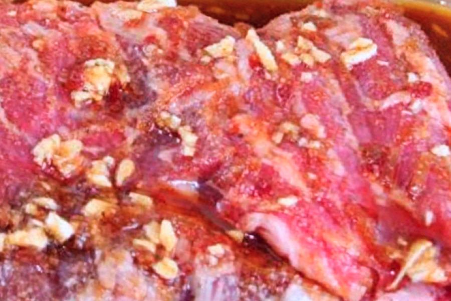 Detail of beef flank steak marinating.