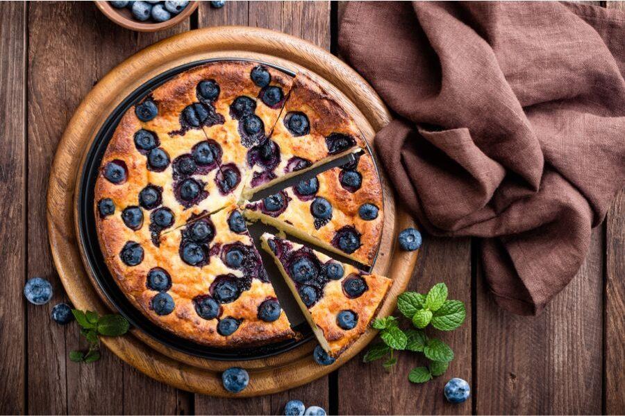 Blueberry cake on a serving plate.