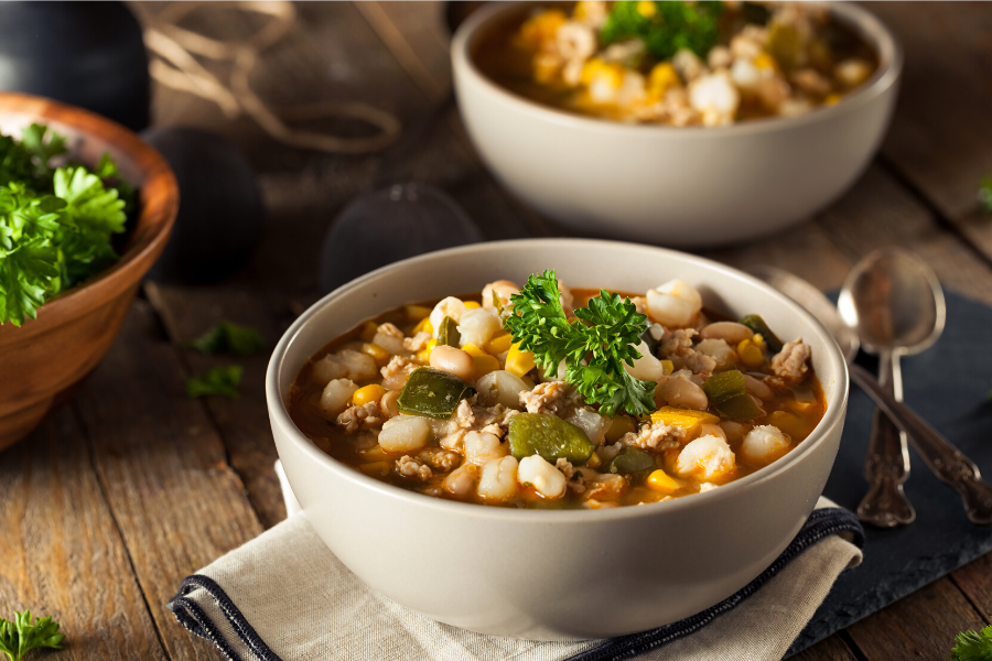 A bowl with chicken chili.