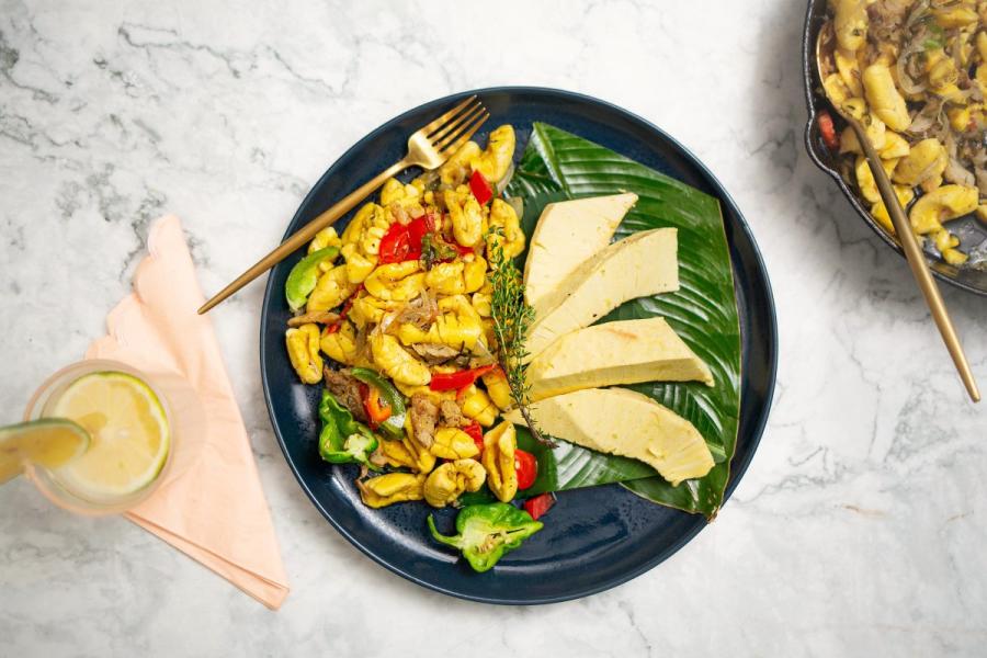 Ackee and saltfish with breadfruit ina a plate.