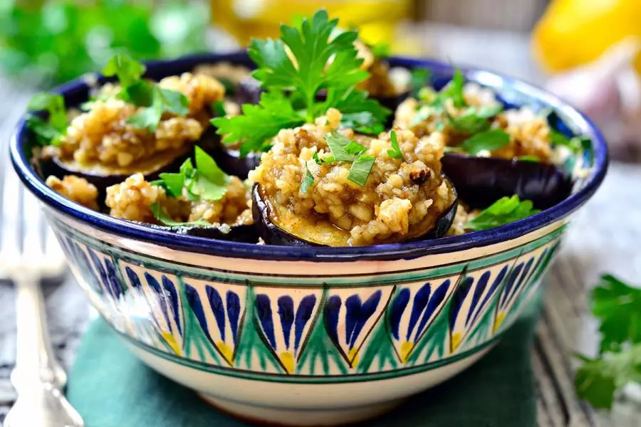 Fried eggplant slices topped with aillade sauce.