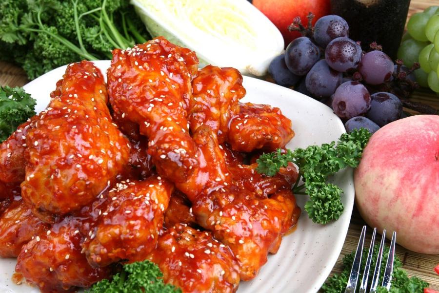 Fried chicken coated in hot yangyeom sauce.