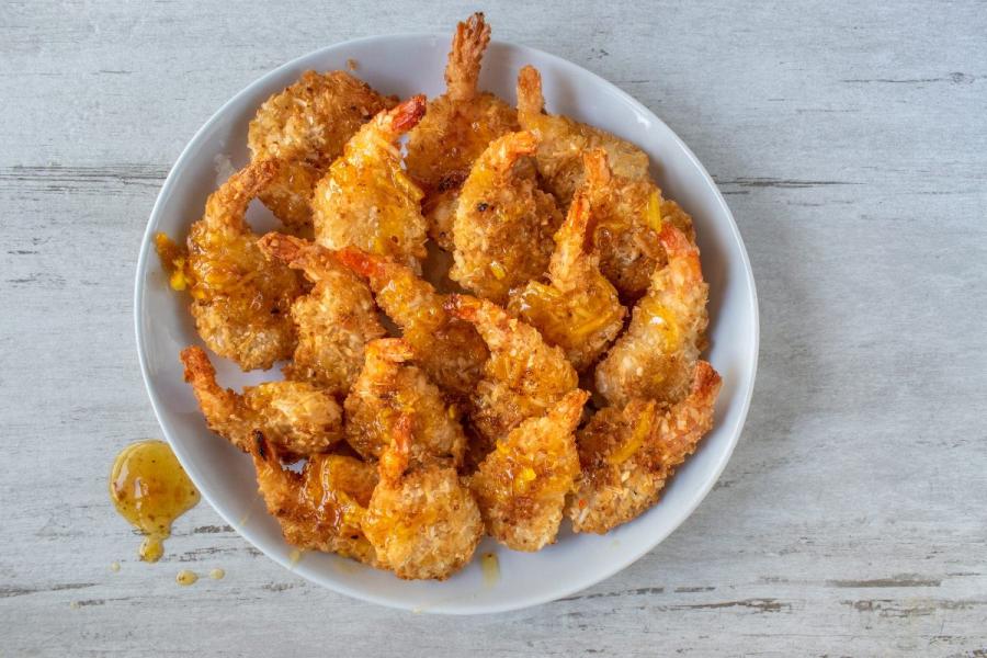 A bowl of fried coconut shrimp.