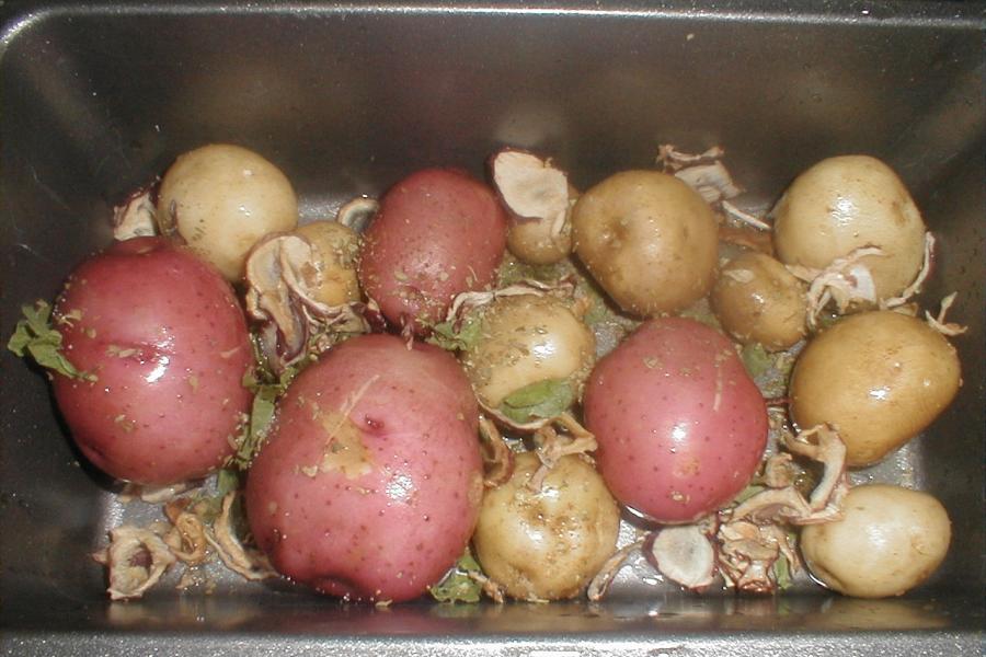 Roast potatoes in oven tray.