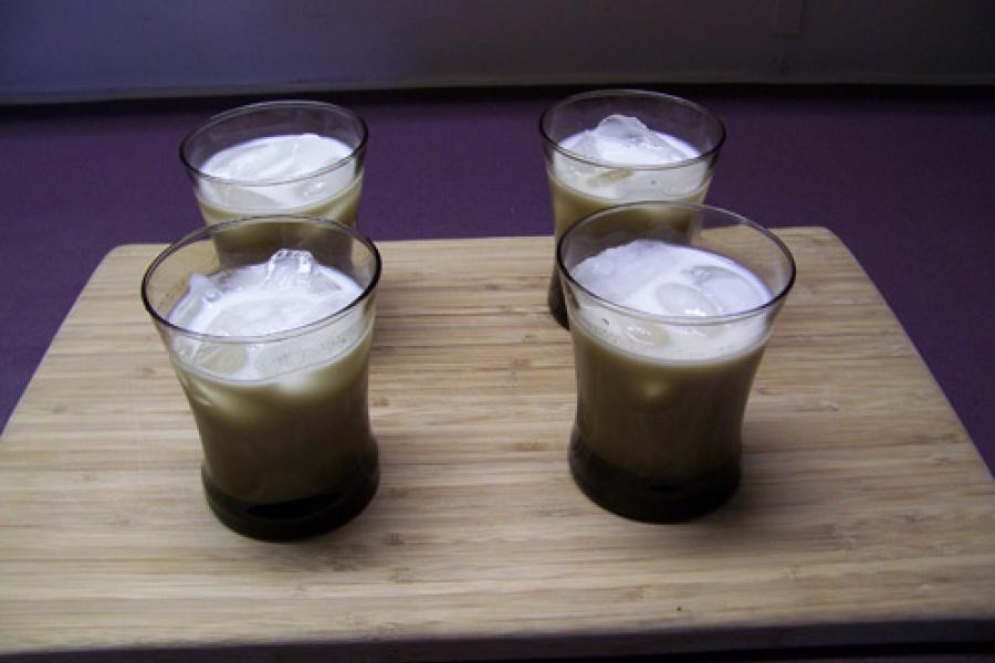 Four glasses with rum horchata.
